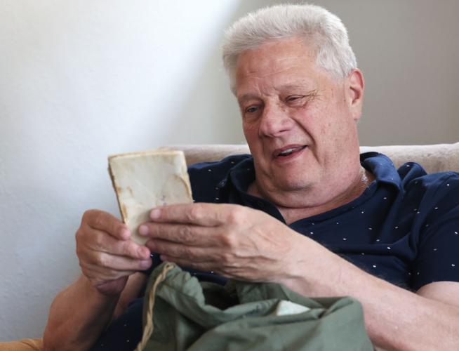 Foseid holding letters